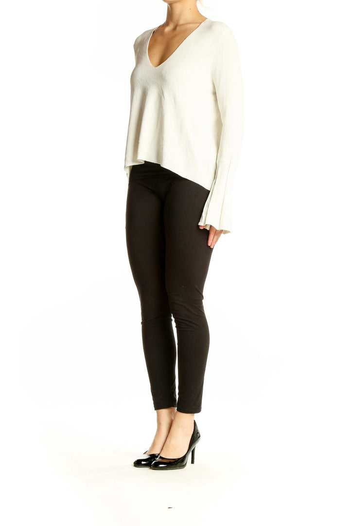 Front view of white ASOS V-neck top with bell sleeves