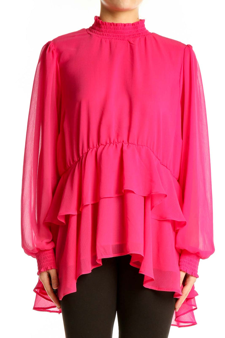 Front view of hot pink ruffled chiffon blouse from Torrid