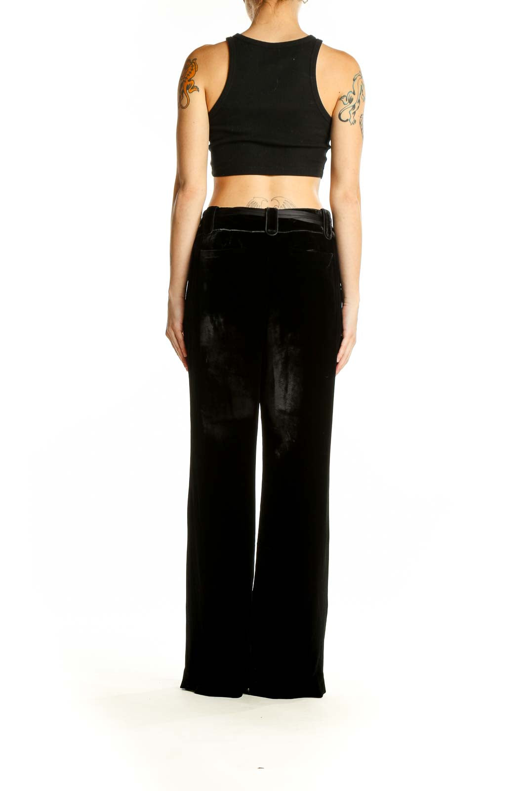 Back view of Ann Taylor black wide-leg pants on model with crop top