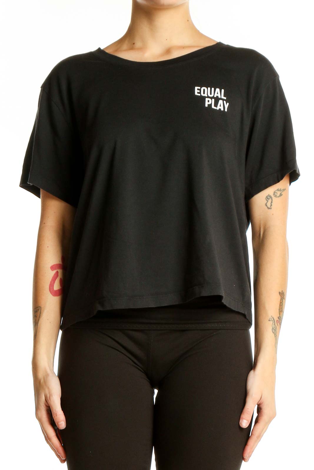 Front view of black Athleta cropped athletic top with EQUAL PLAY text