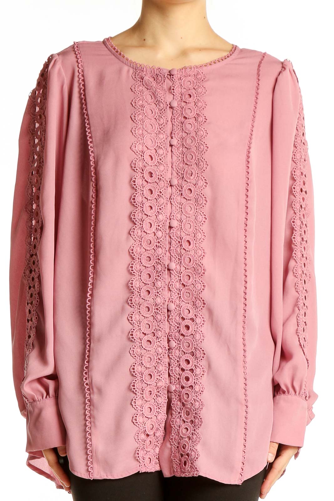 Front view of pink lace-trimmed polyester blouse from Torrid