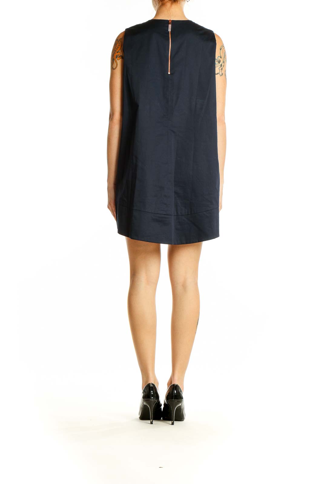 Side view of Ted Baker London navy mini dress showing high-low hemline