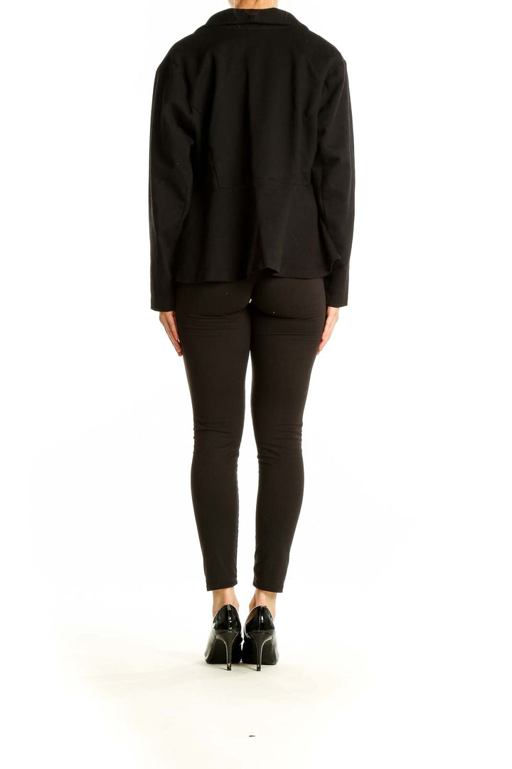 Side view of Studio by TORRID black cropped blazer on model with black pants