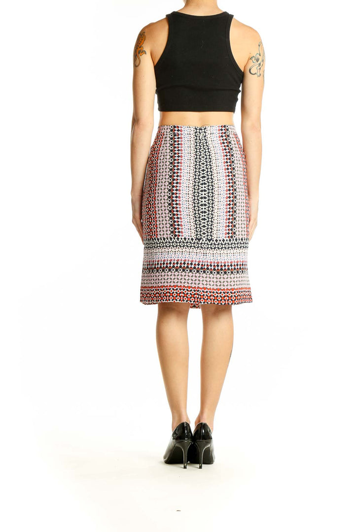 Side view of J.Crew multicolor geometric print pencil skirt with black crop top