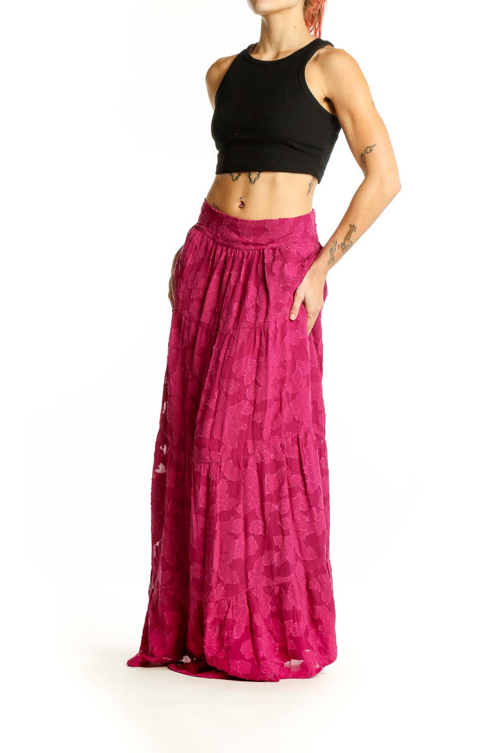 Front view of En Creme fuchsia floral lace maxi skirt with tiered design