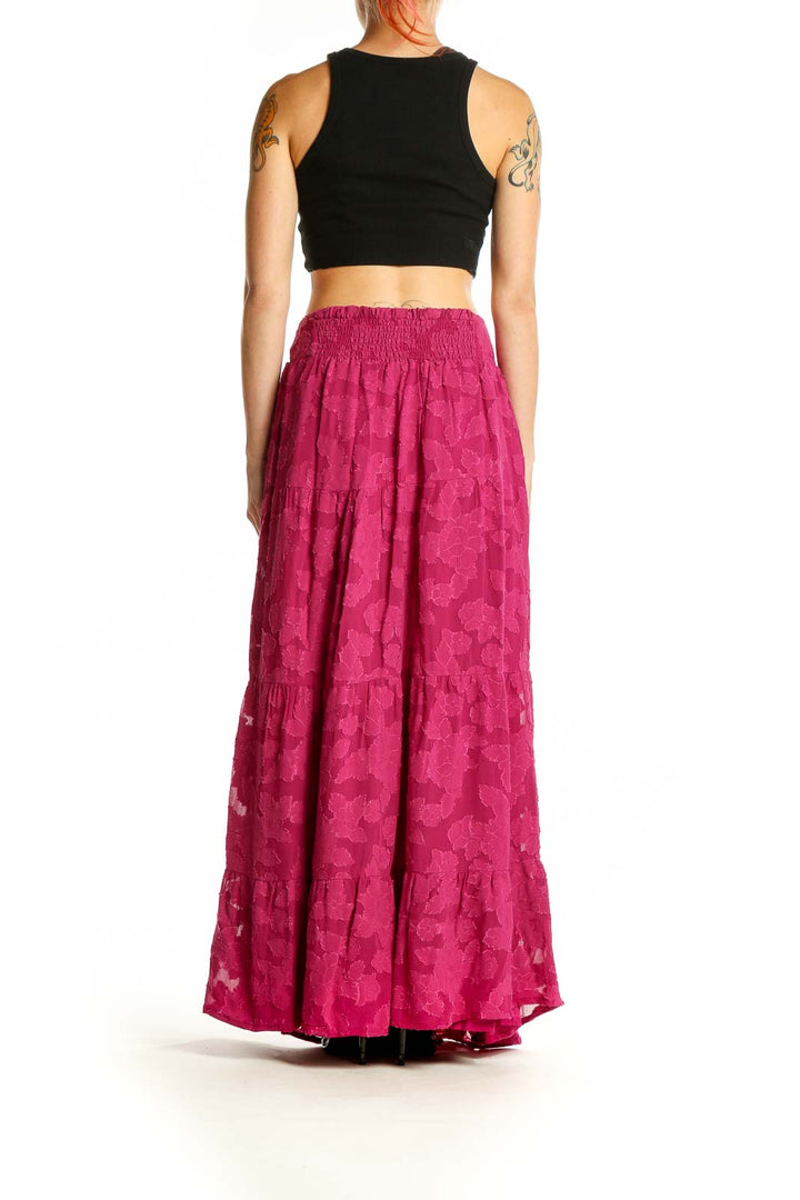 Side view of En Creme fuchsia floral lace maxi skirt on model with black crop top