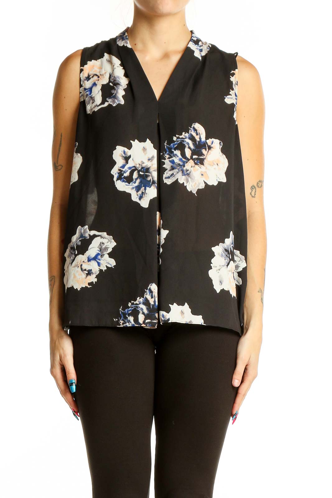 Front view of Vince Camuto black sleeveless blouse with white and blue floral print