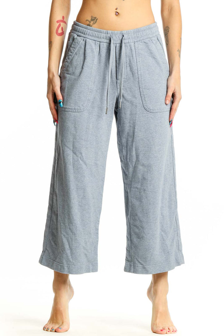 Front view of Athleta gray wide-leg cropped pants on model