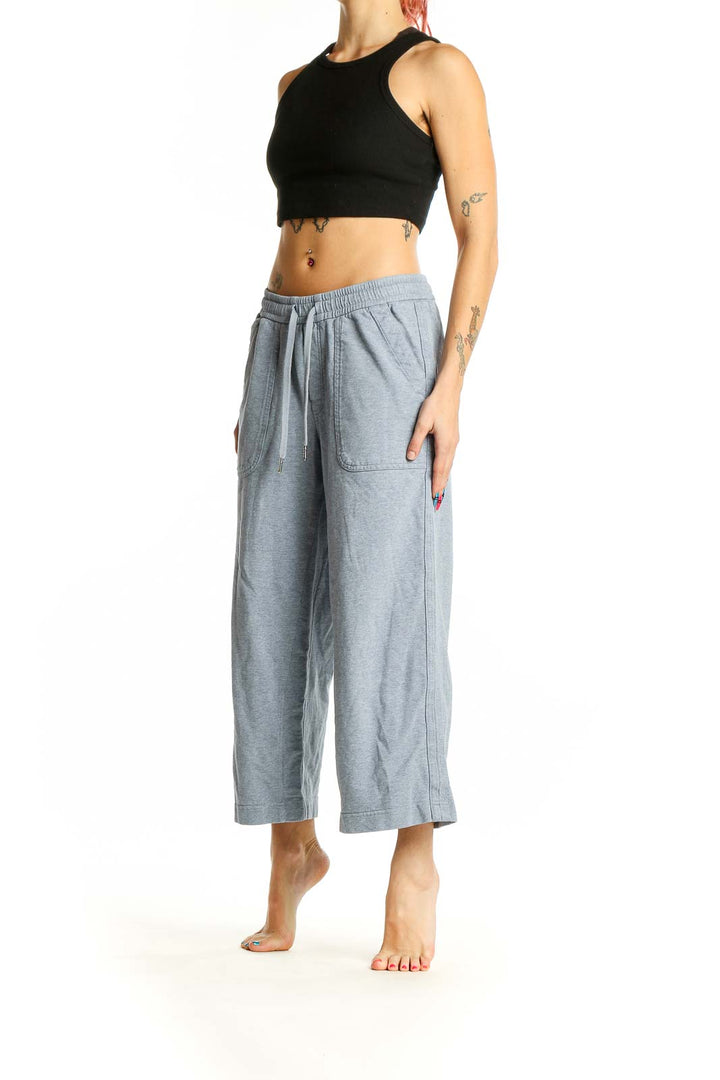 Front view of Athleta gray wide-leg cropped pants on model