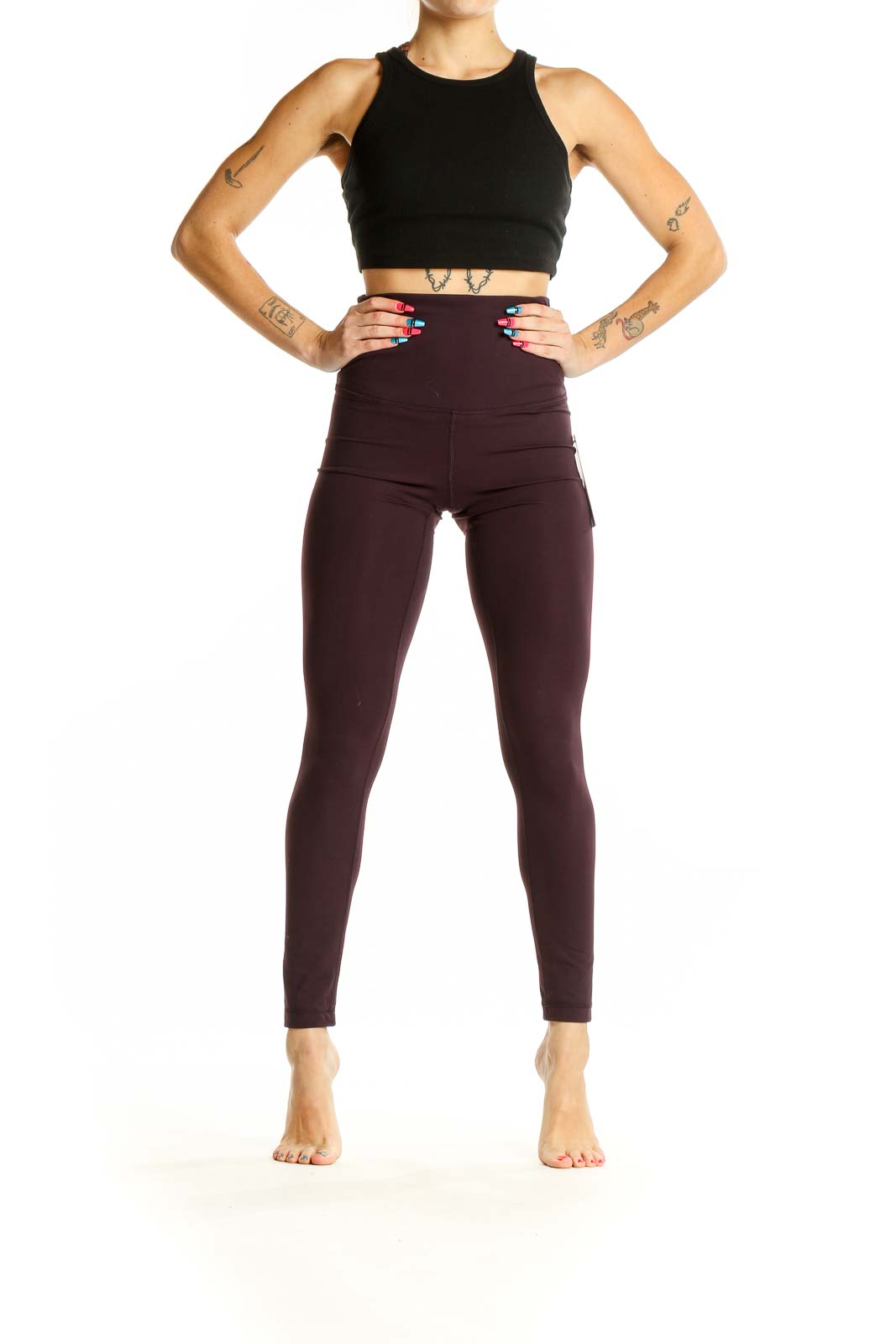 Front view of Yogalicious burgundy high-waisted yoga leggings on model