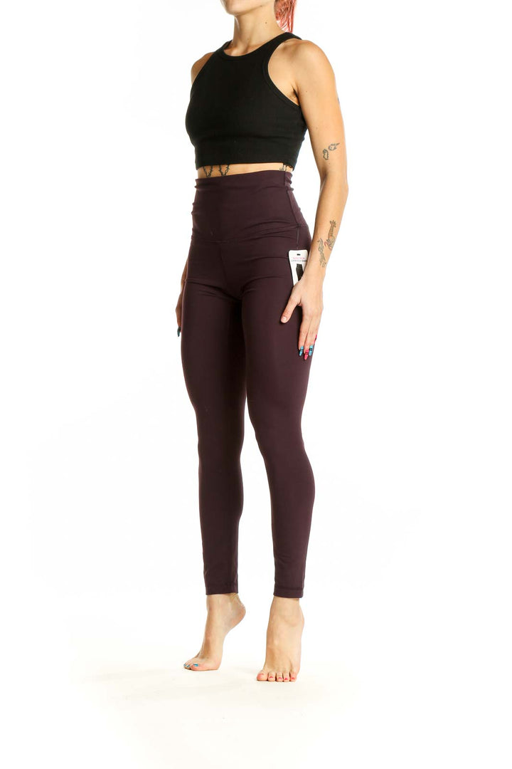 Front view of Yogalicious burgundy high-waisted yoga leggings on model