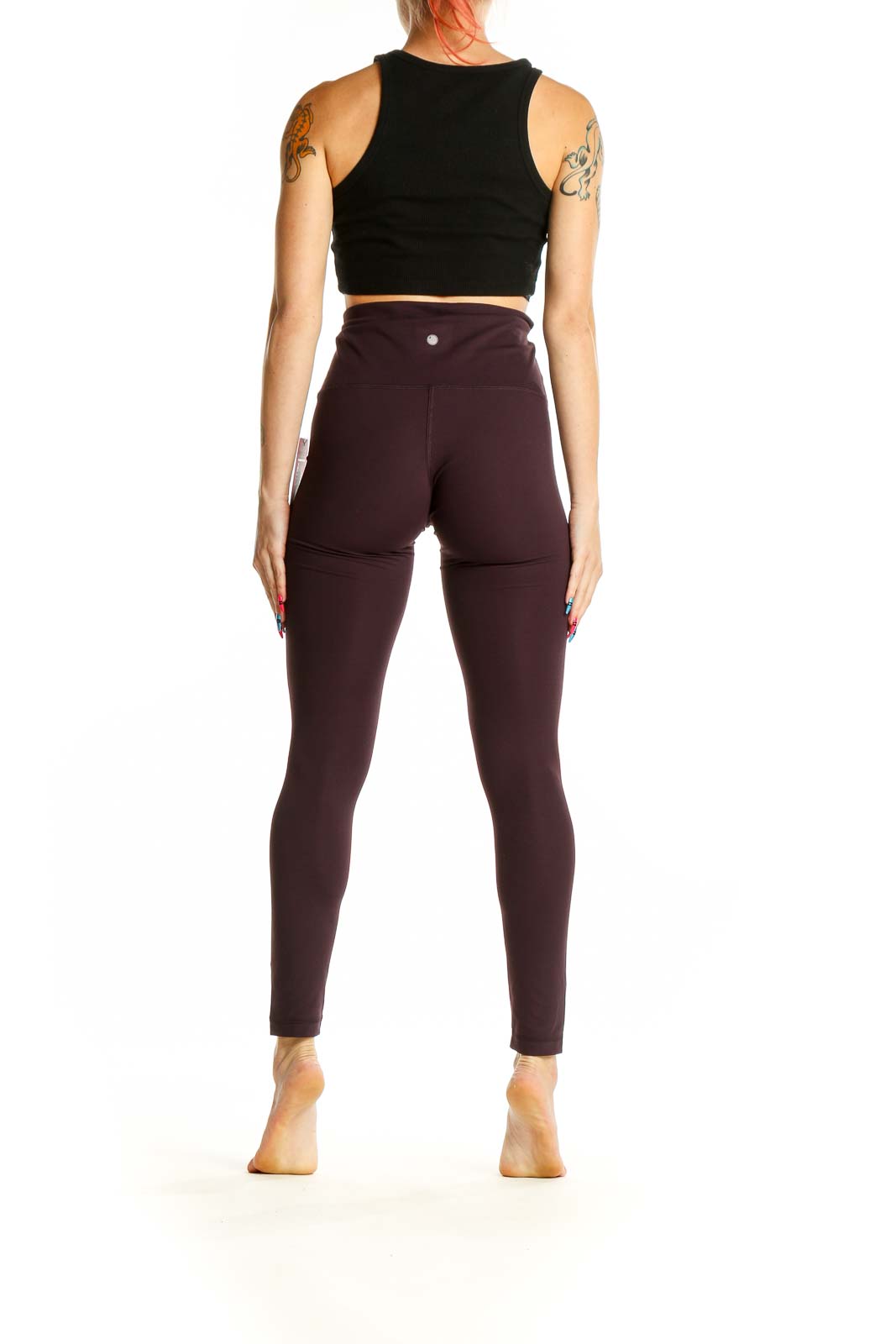 Side view of Yogalicious burgundy high-waisted yoga leggings on model