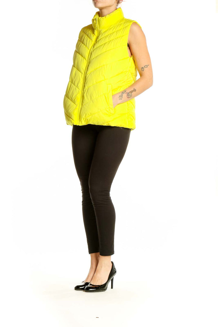 Front view of yellow quilted puffer vest from Gap