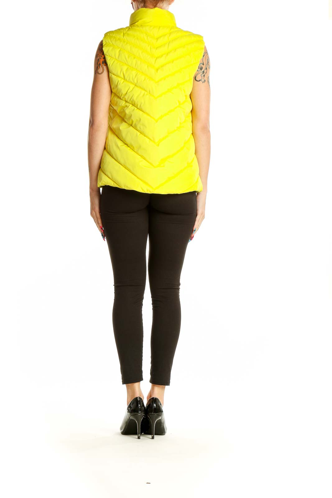 Back view of yellow quilted puffer vest from Gap