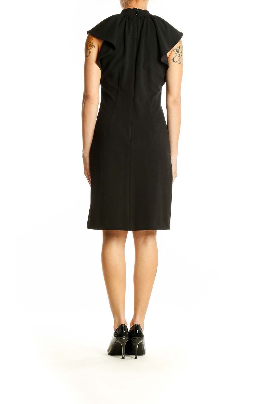 Side view of Calvin Klein black sheath dress showing fitted silhouette