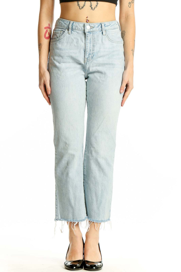 Front view of Topshop light blue cropped straight-leg jeans with frayed hem