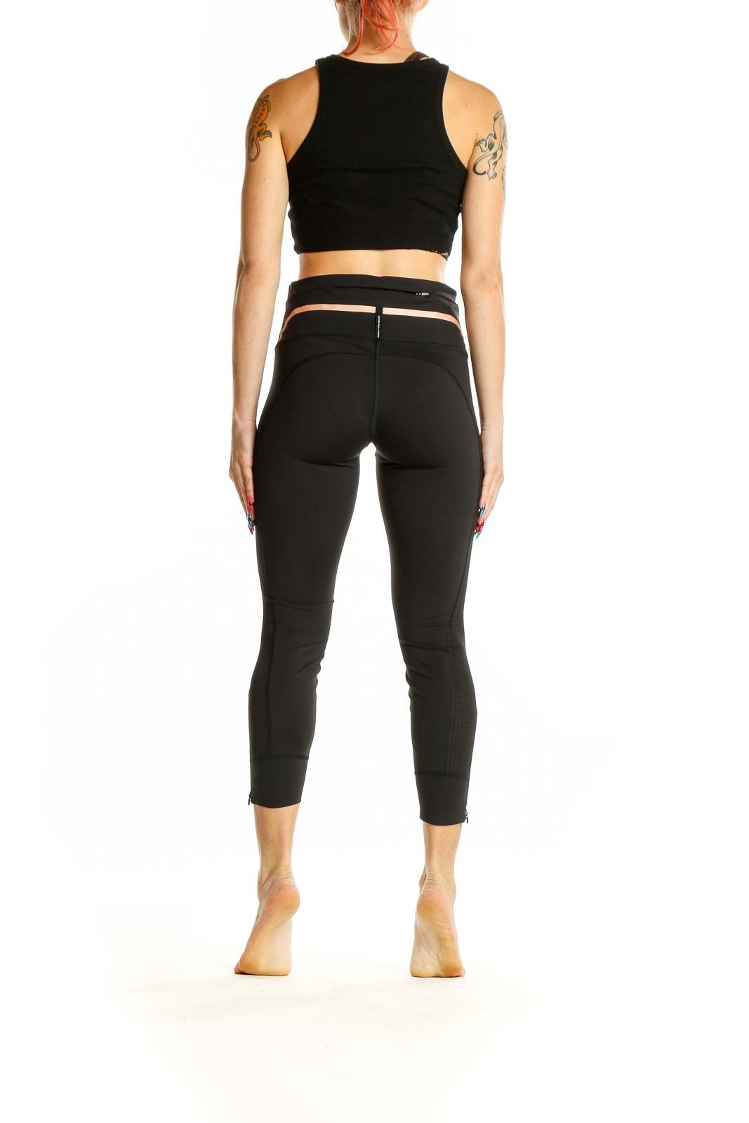 Side view of woman wearing Athleta black activewear set