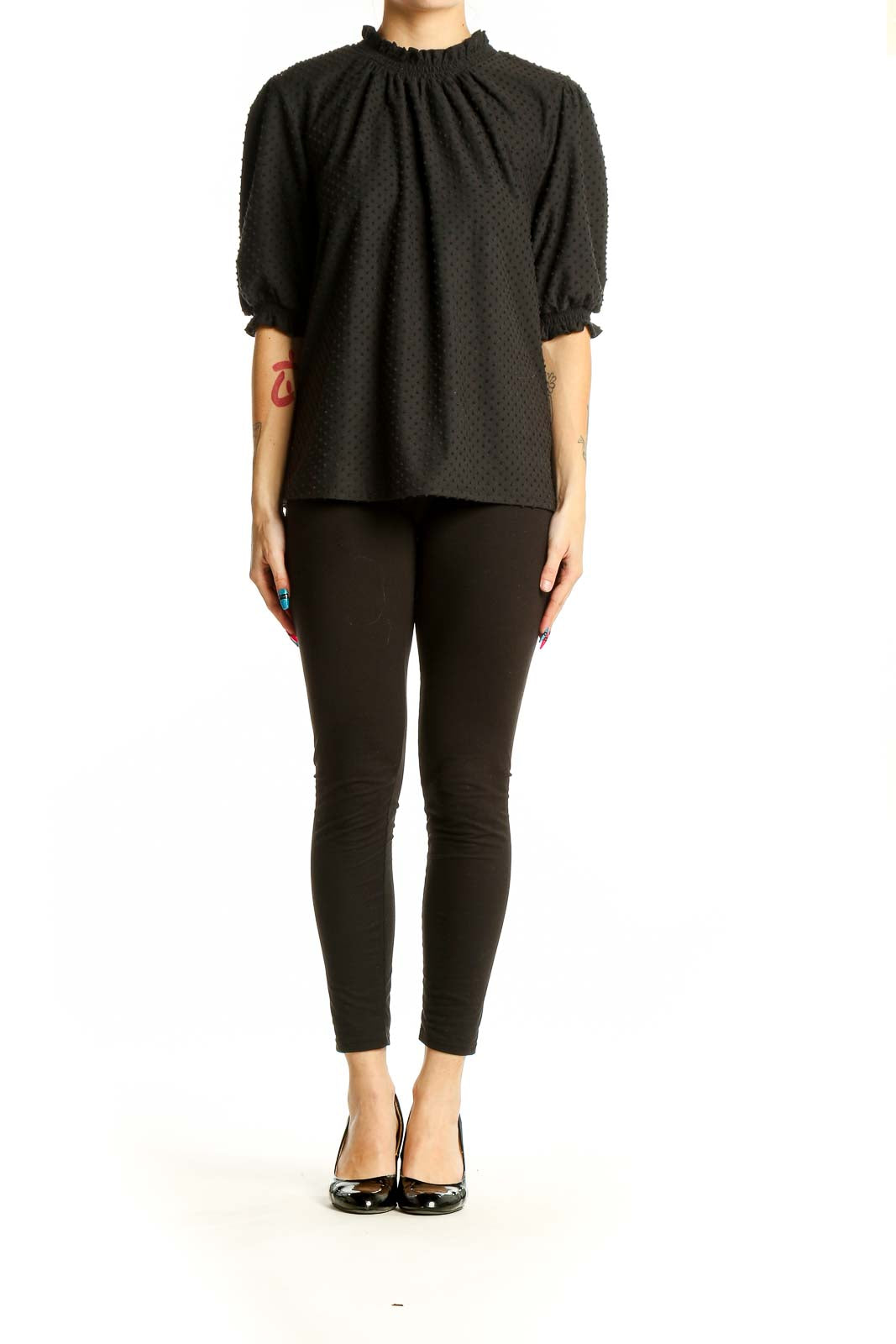 Front view of J.Crew black textured top with puff sleeves