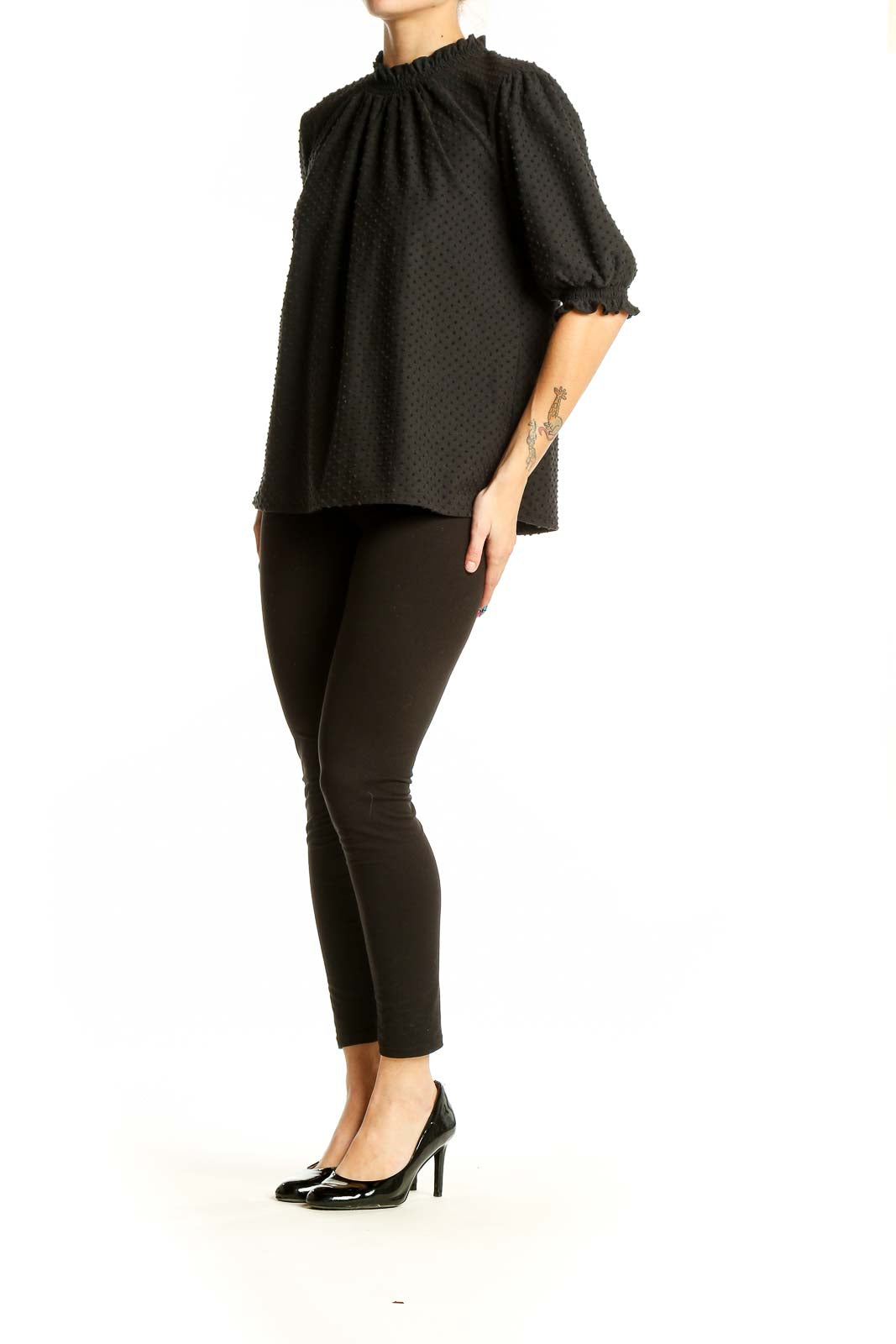 Front view of J.Crew black textured top with puff sleeves