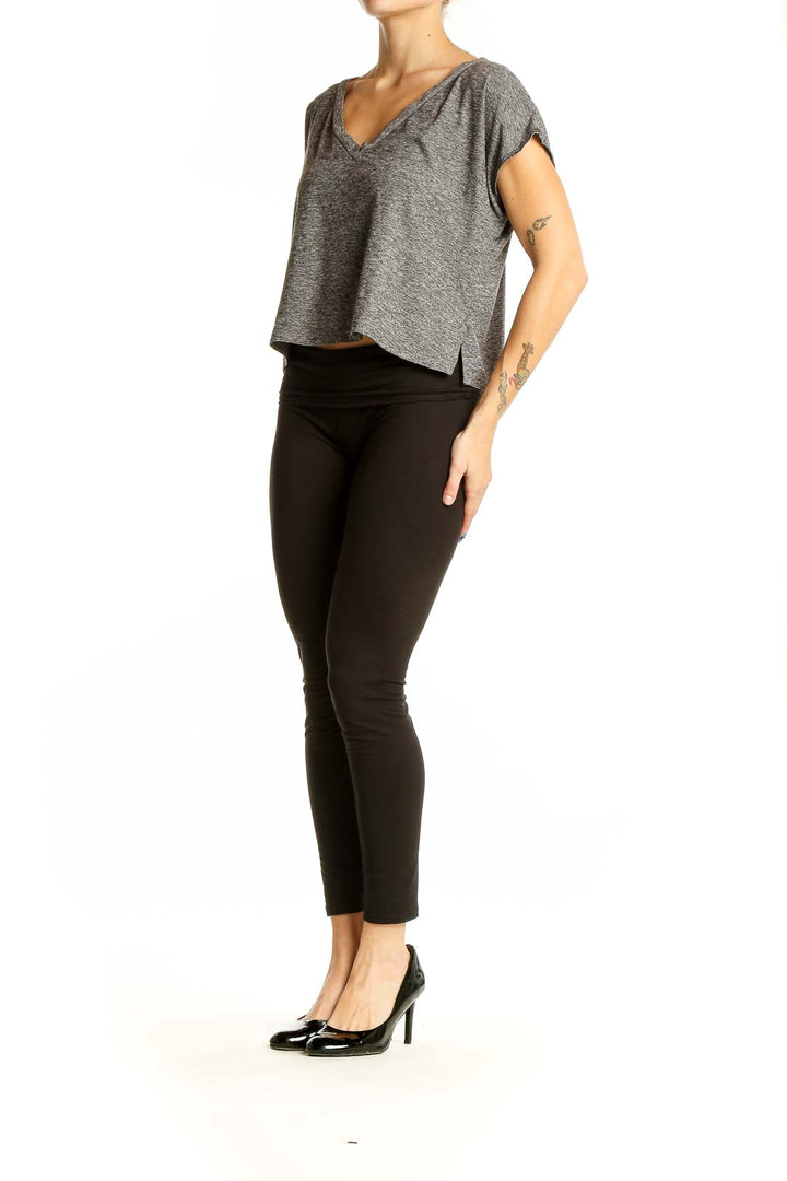 Front view of Beyond Yoga gray V-neck cropped athletic top