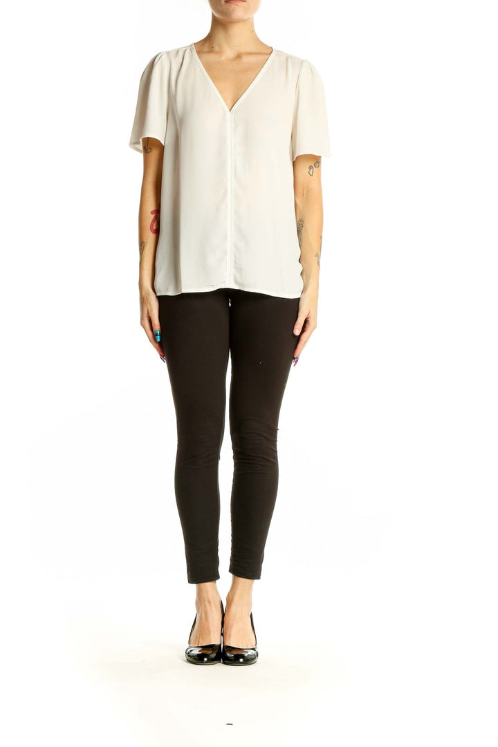 Front view of J.Crew white V-neck blouse with flutter sleeves