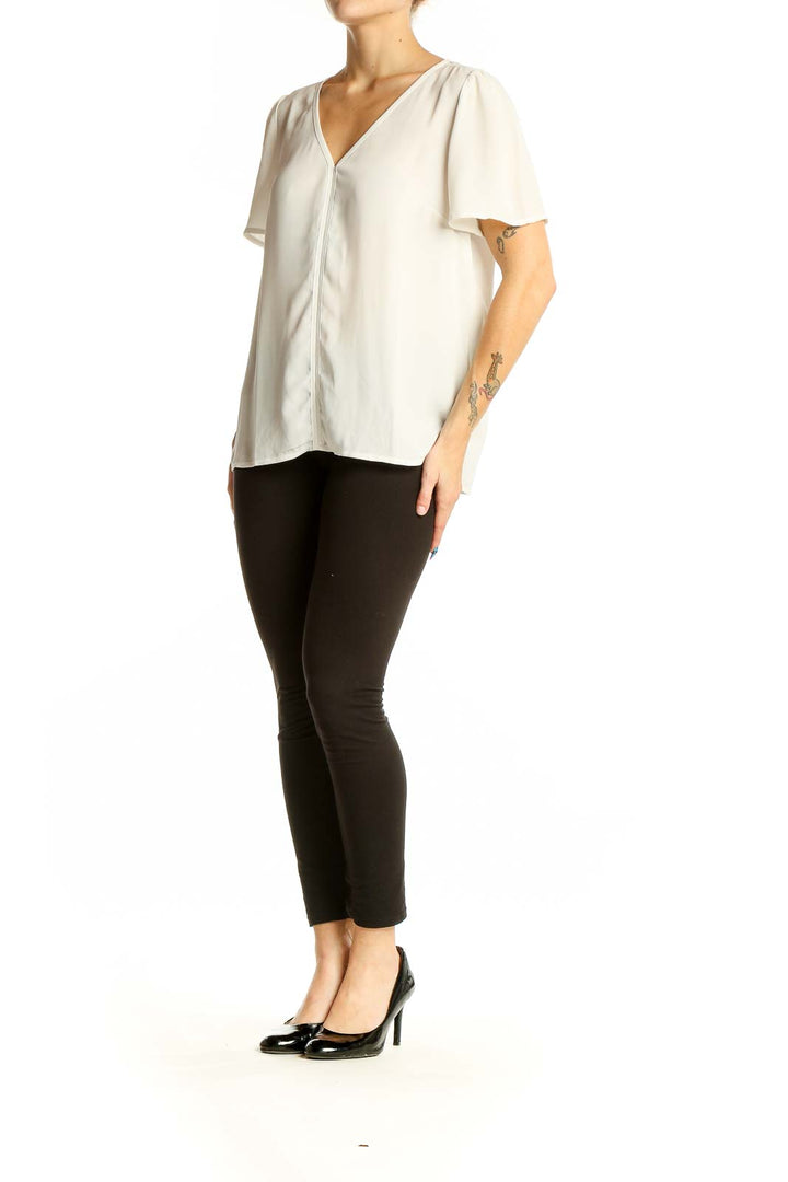 Front view of J.Crew white V-neck blouse with flutter sleeves