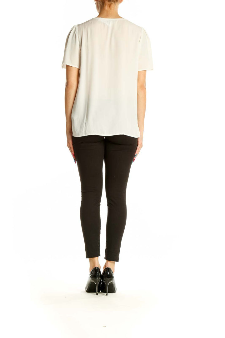 Back view of J.Crew white V-neck blouse showing relaxed fit