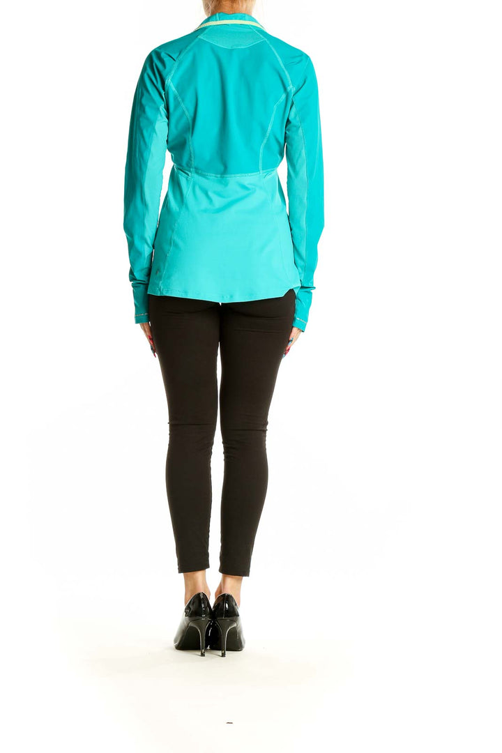 Back view of teal Lululemon quarter-zip athletic top