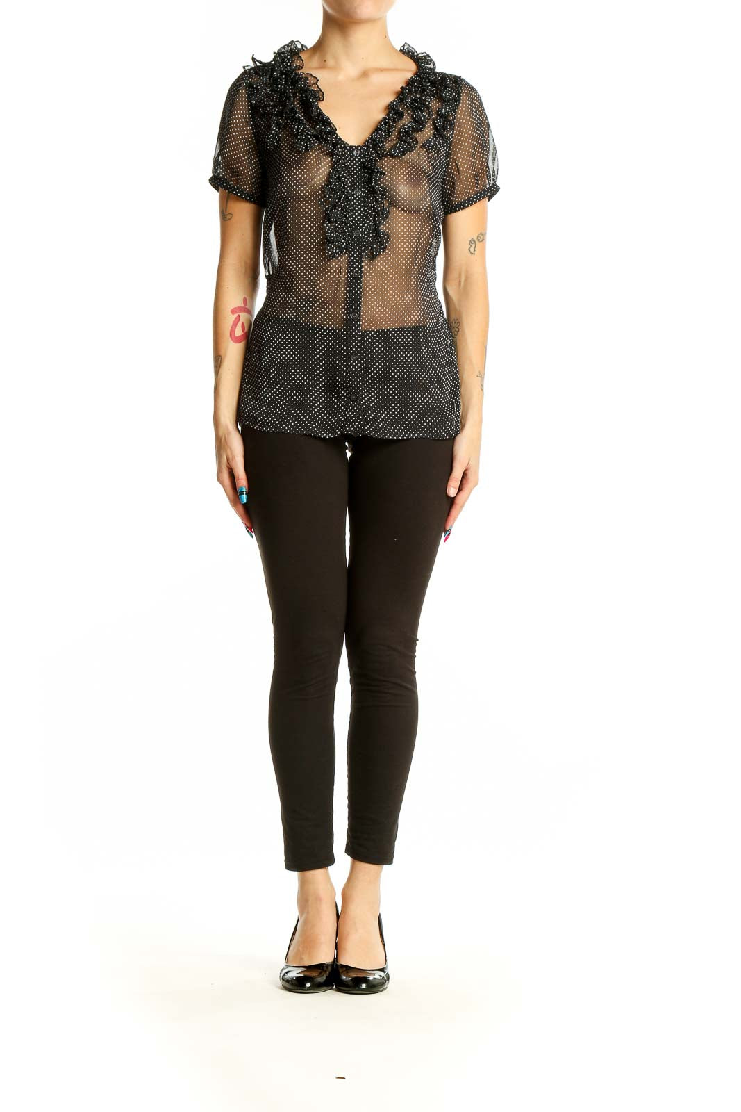 Front view of black sheer polka dot blouse with ruffle neckline from The Limited