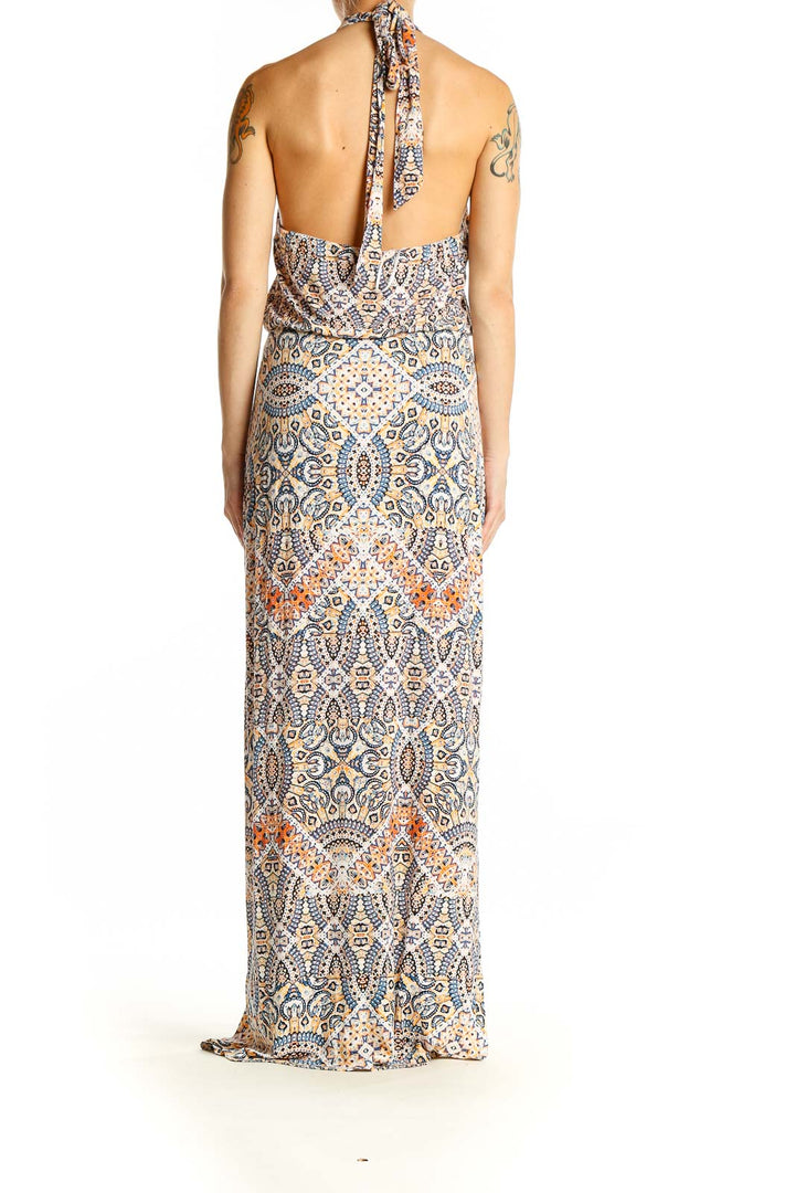 Side view of Cynthia Rowley blue paisley halter maxi dress