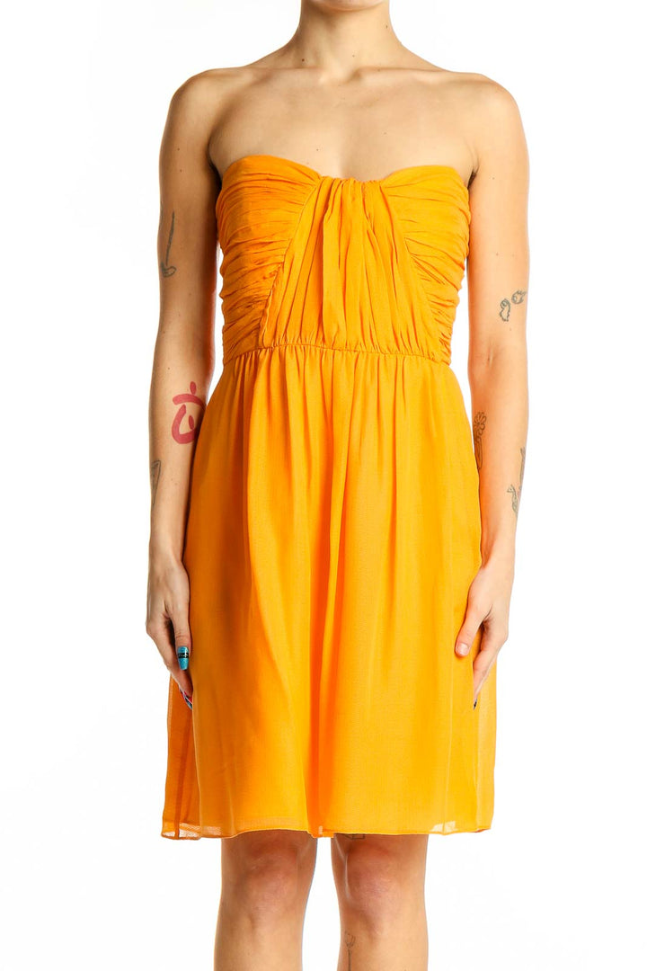 Front view of yellow strapless ruched cocktail dress by Shoshanna