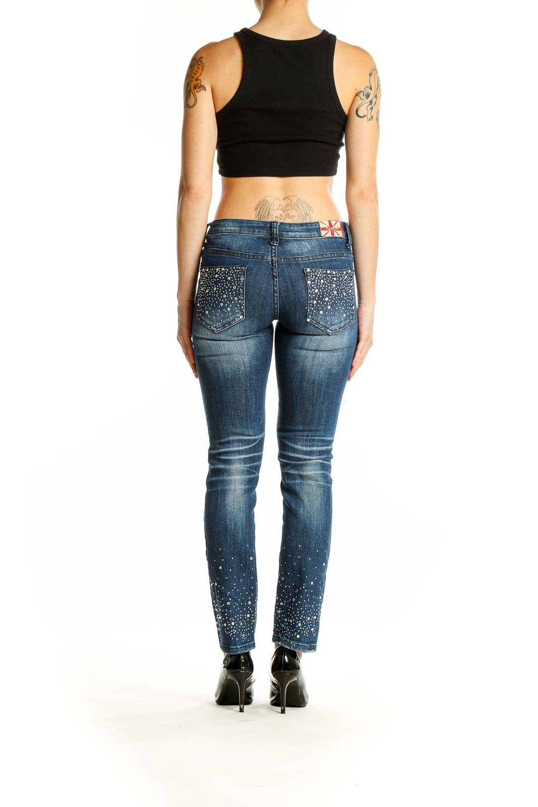 Back view of Machine blue distressed skinny jeans with embellishments