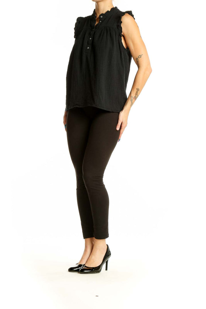 Front view of J.Crew black cotton sleeveless top with ruffle details