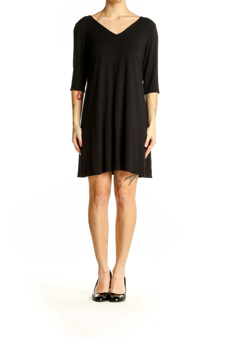 Front view of Eileen Fisher black V-neck flowy tunic top