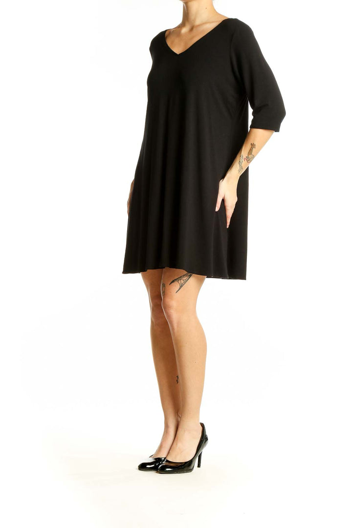 Front view of Eileen Fisher black V-neck flowy tunic top