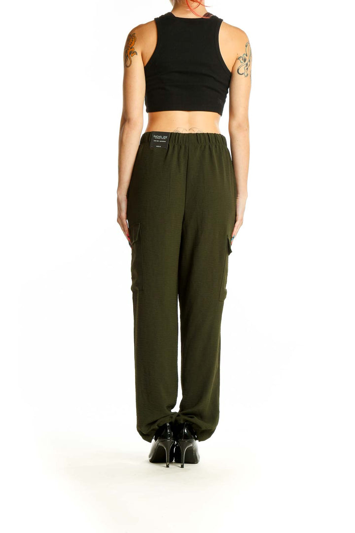 Side view of olive green Rachel Zoe cargo pants on model with black crop top