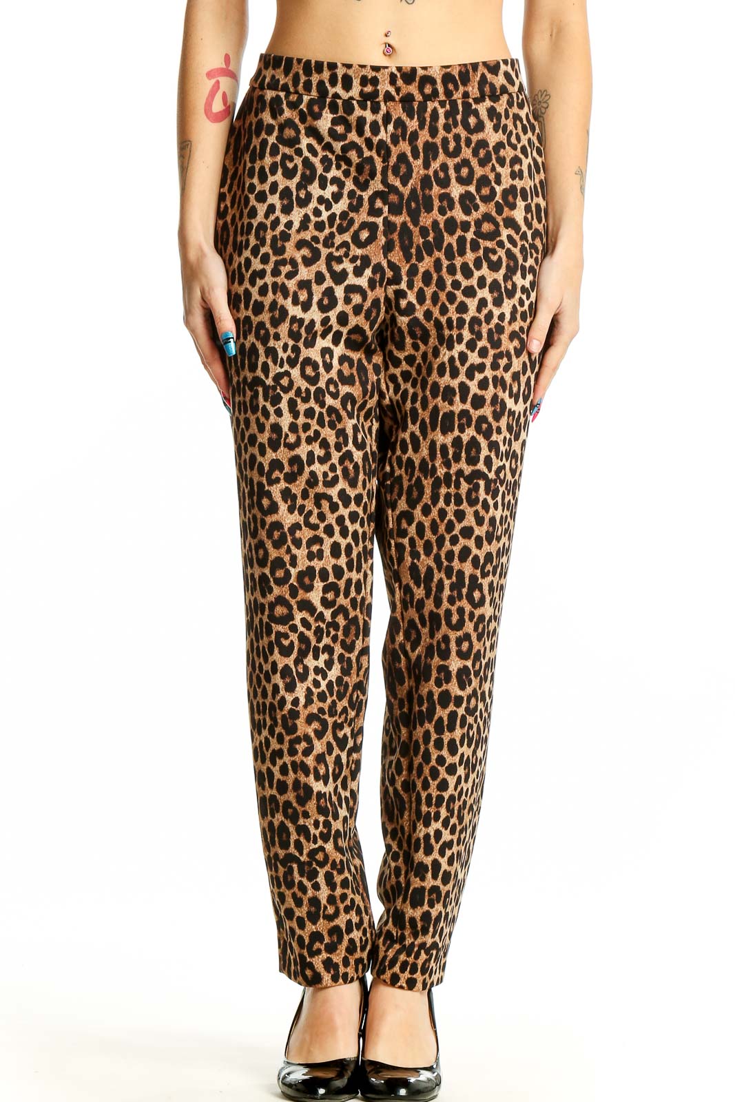 Front view of Michael Kors leopard print trousers on model