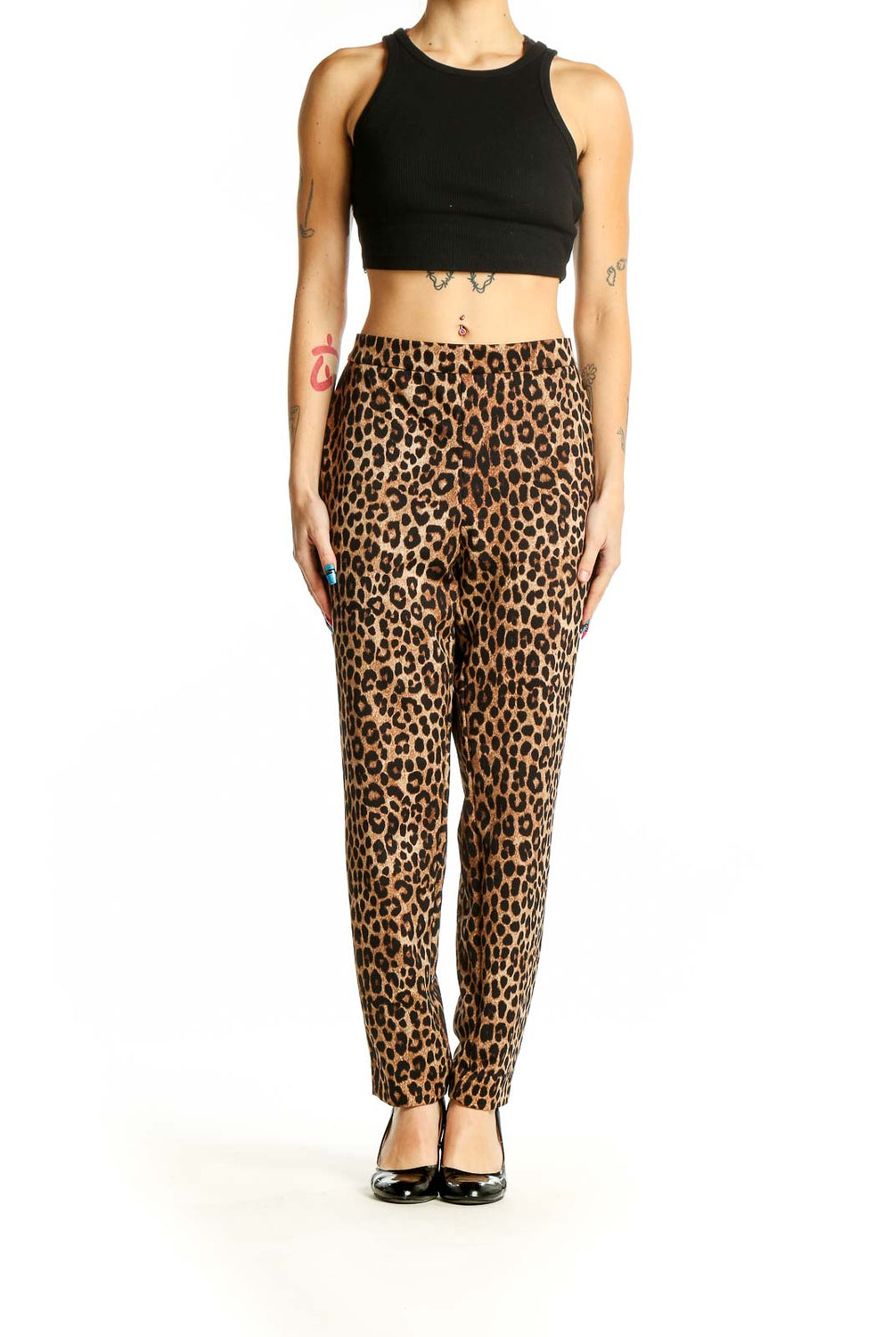 Front view of Michael Kors leopard print trousers on model