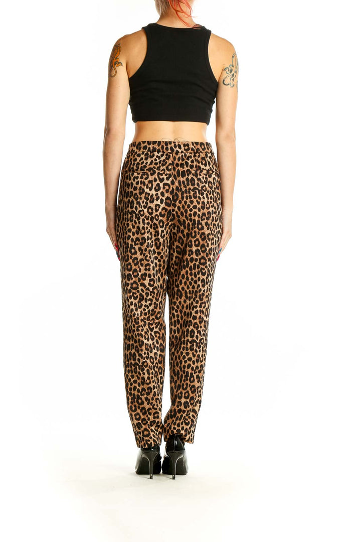 Back view of Michael Kors leopard print trousers with black crop top