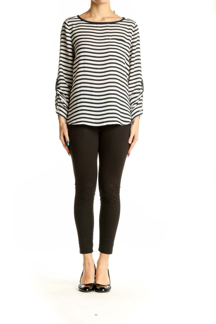 Front view of LOFT black and white striped polyester blouse with long sleeves