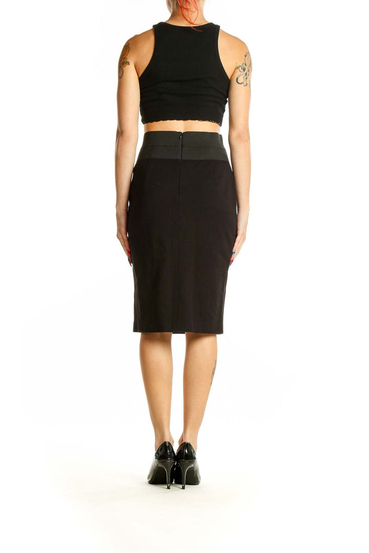 Back view of Akris black pencil skirt with crop top