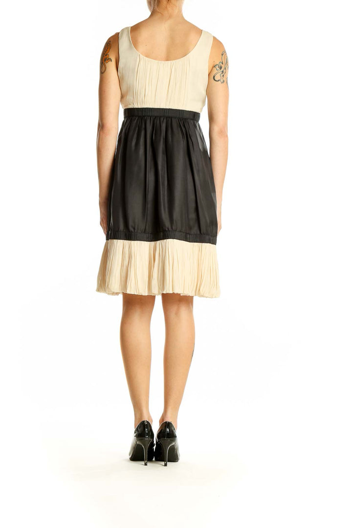 Back view of Yoana Baraschi cream and black color block sleeveless dress