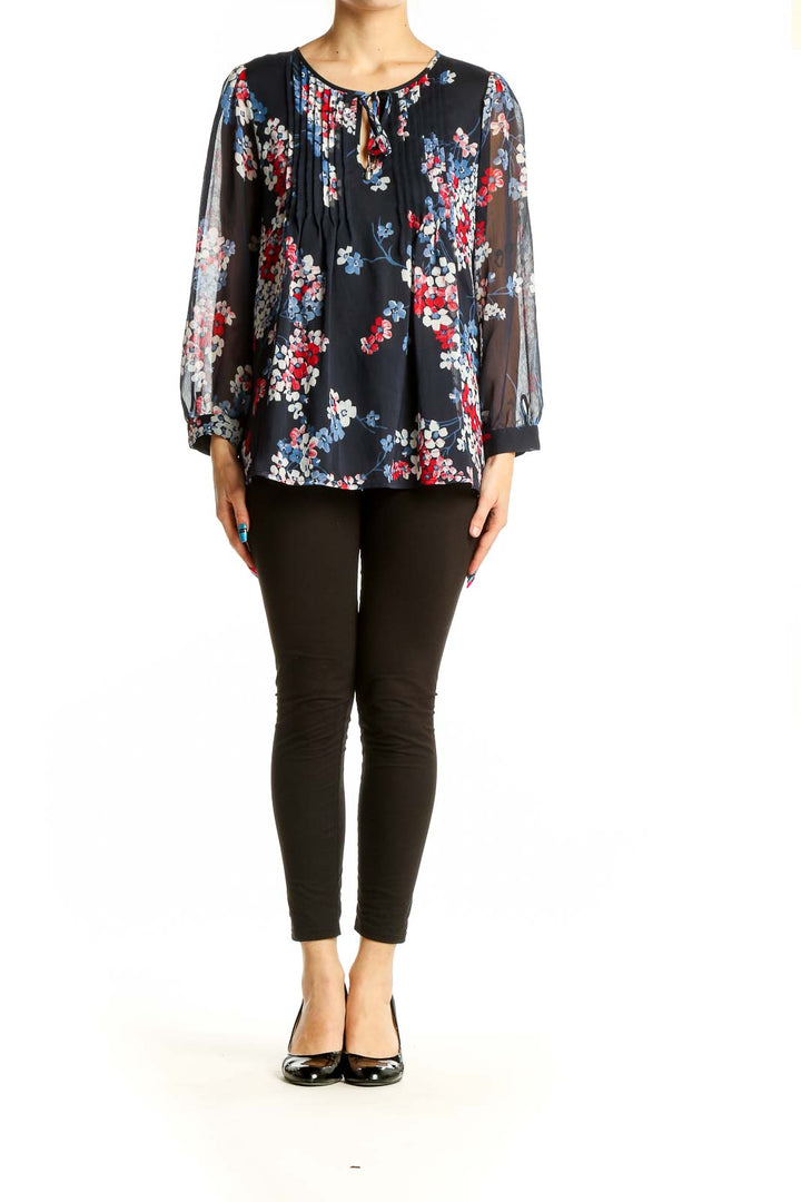 Front view of Tommy Hilfiger navy floral print sheer blouse with pleated detail