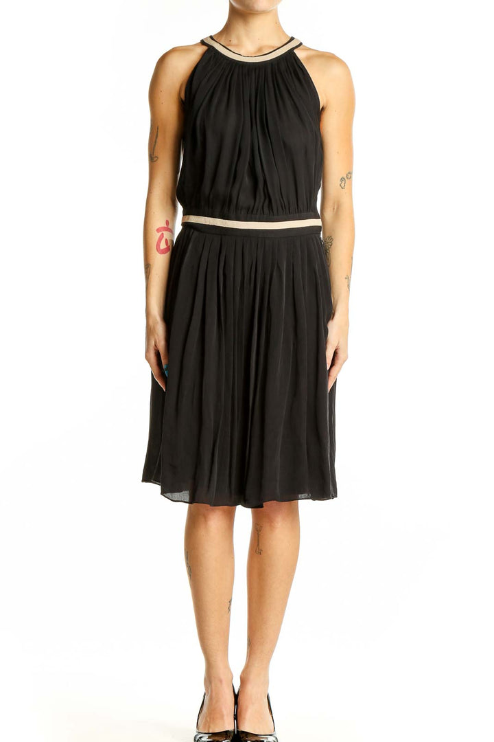 Front view of L'AGENCE black silk halter neck cocktail dress with gold-tone accents