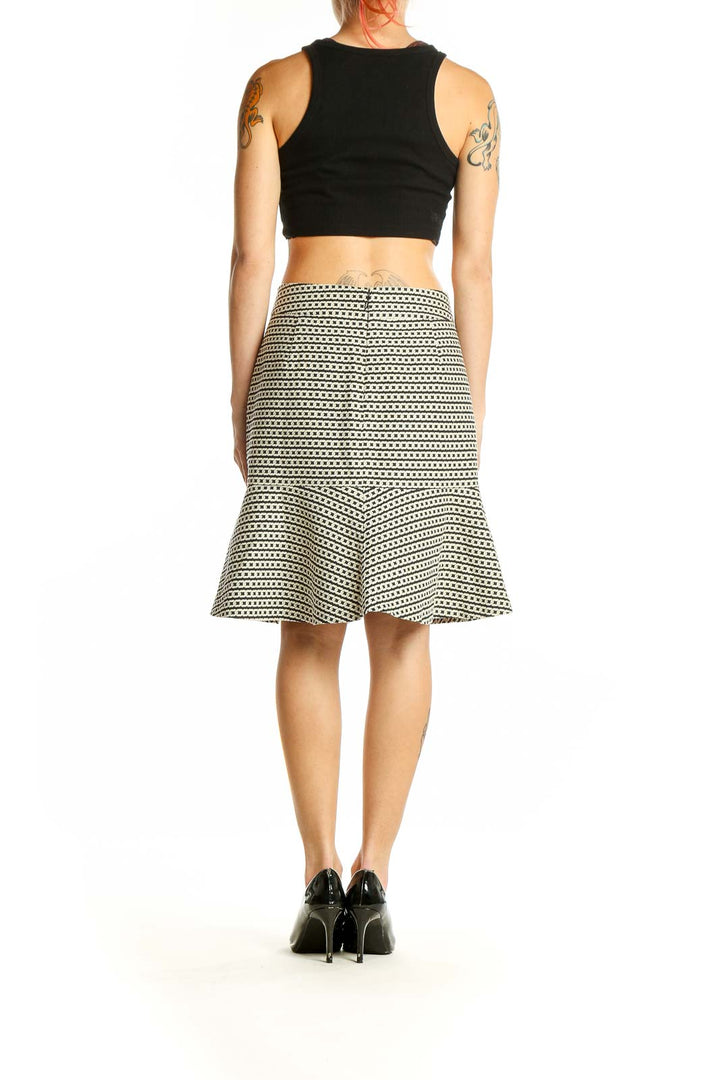 Side view of Banana Republic Black and White Striped Flared Skirt on model