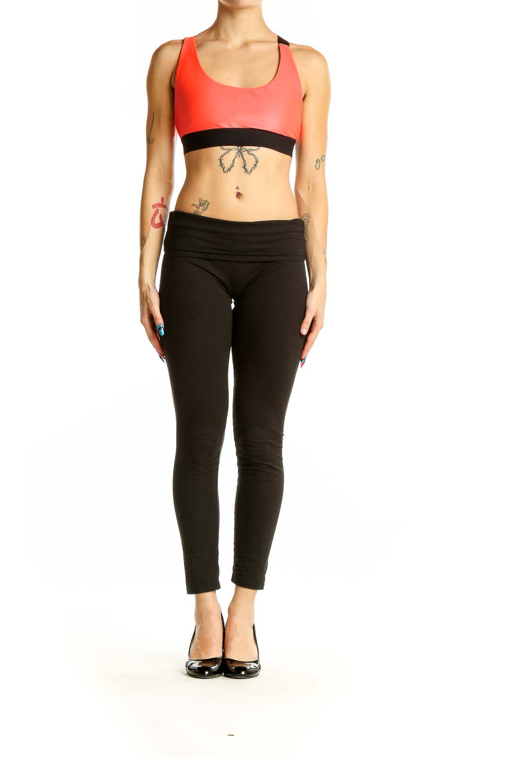 Front view of red KORAL athletic crop top with black band