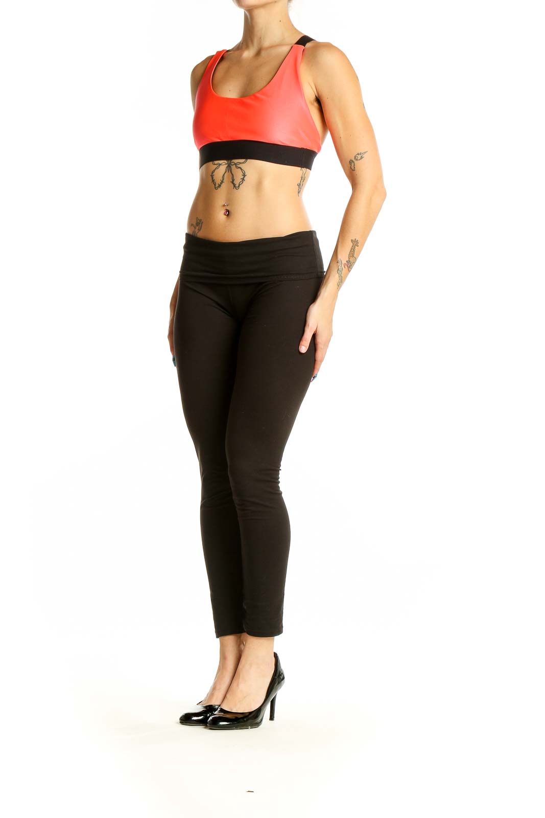 Front view of red KORAL athletic crop top with black band