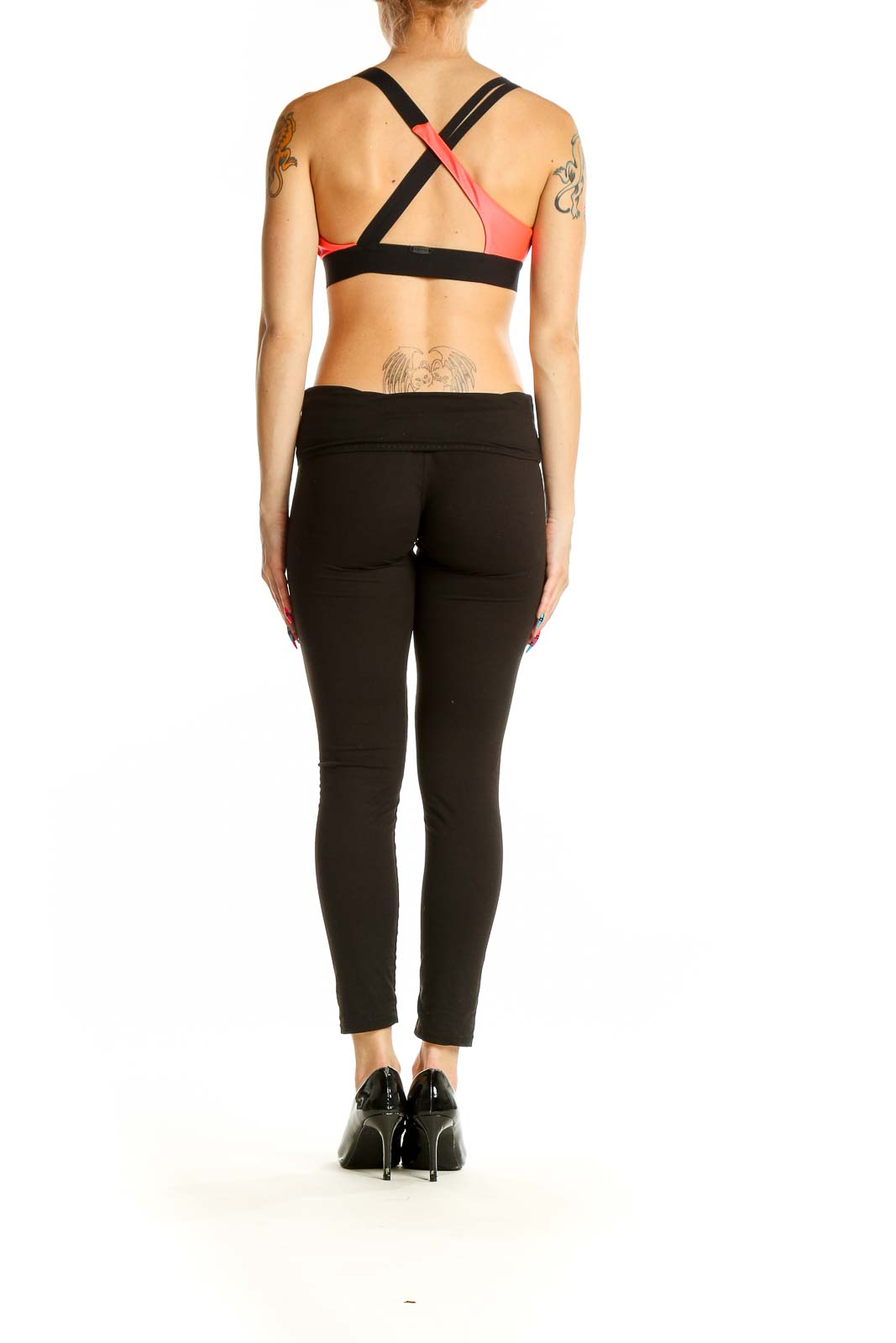 Back view of red KORAL athletic crop top showing racerback design