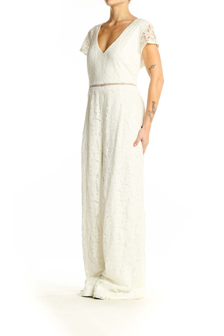 Front view of Lulu's white lace V-neck wide-leg jumpsuit