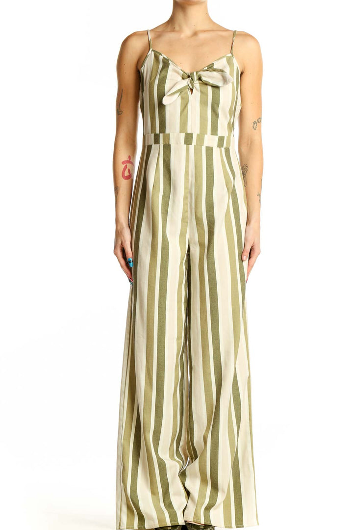 Front view of green and cream striped wide-leg jumpsuit with bow detail